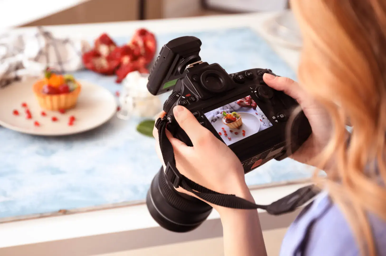Photographer shooting a plated dessert