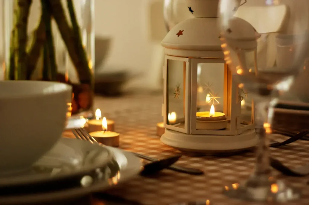Candlelit dining table with lantern centerpiece