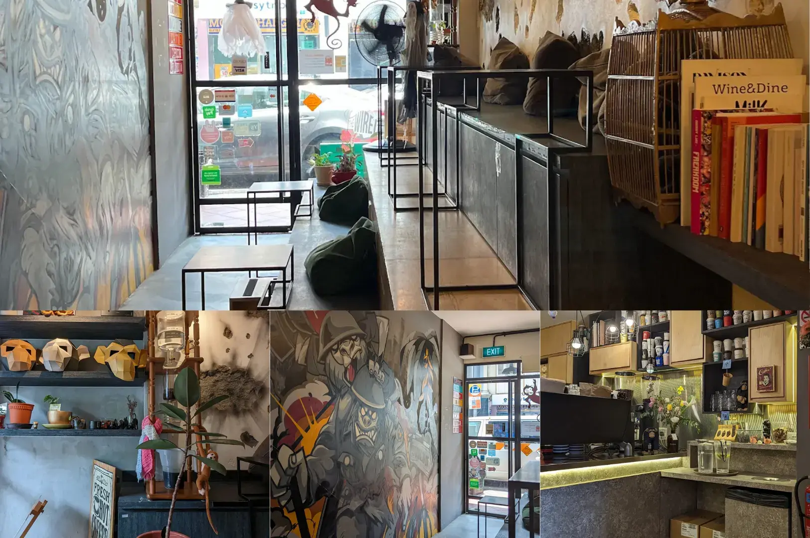 The Wired Monkey interior with artistic mural wall, black metal staircase, service counter, retail shelving, and seating area with decorative wall art.